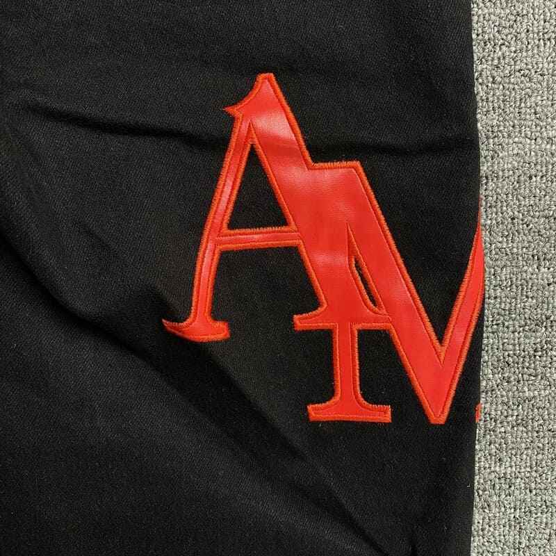 Amiri Black Staggered Logo Jeans